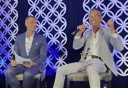 A fireside chat on stage at an investor summit