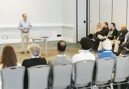 A presenter leading a small-group workshop